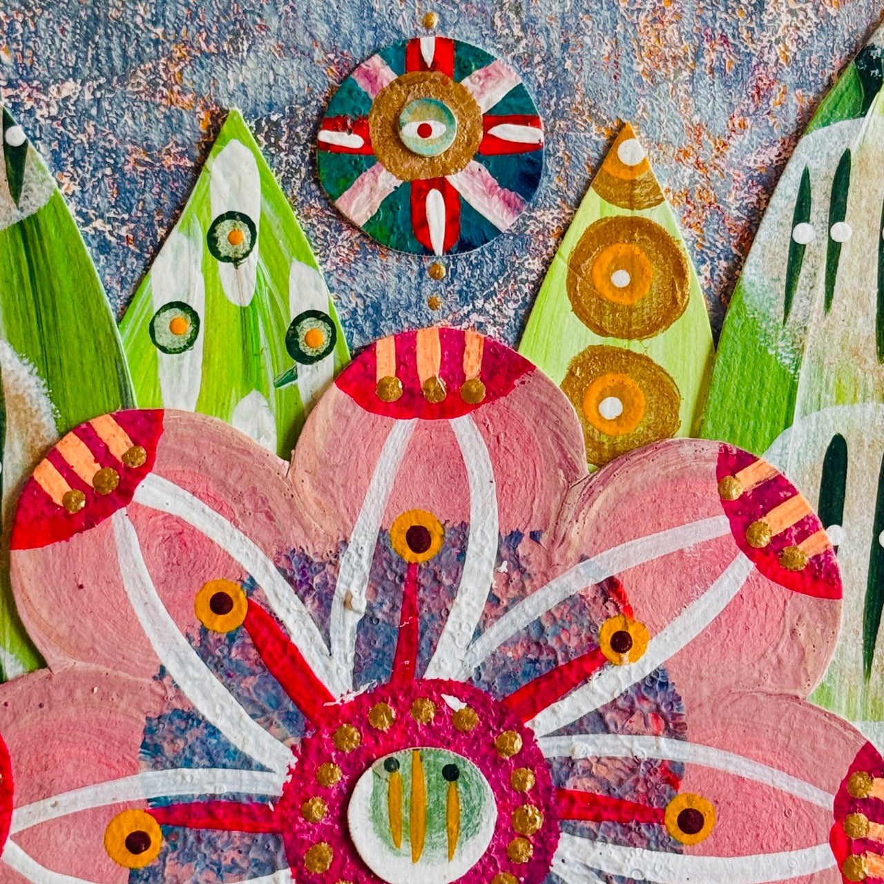 Small square wood panel art with a bold patterned floral design and hand-painted collage elements.