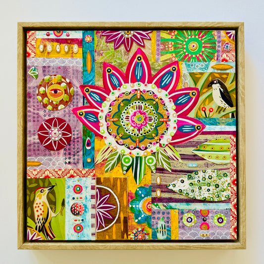 Colorful abstract artwork with floral patterns and birds in a wooden frame.