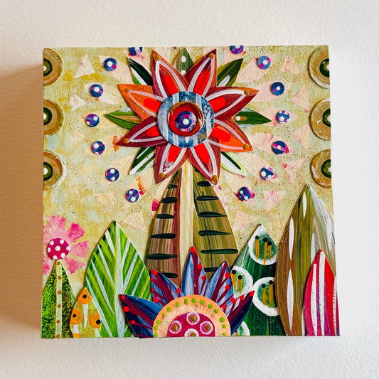 Small square wood panel art with a bold patterned floral design and hand-painted collage elements.