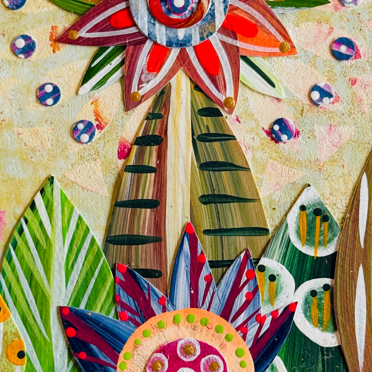 Small square wood panel art with a bold patterned floral design and hand-painted collage elements.