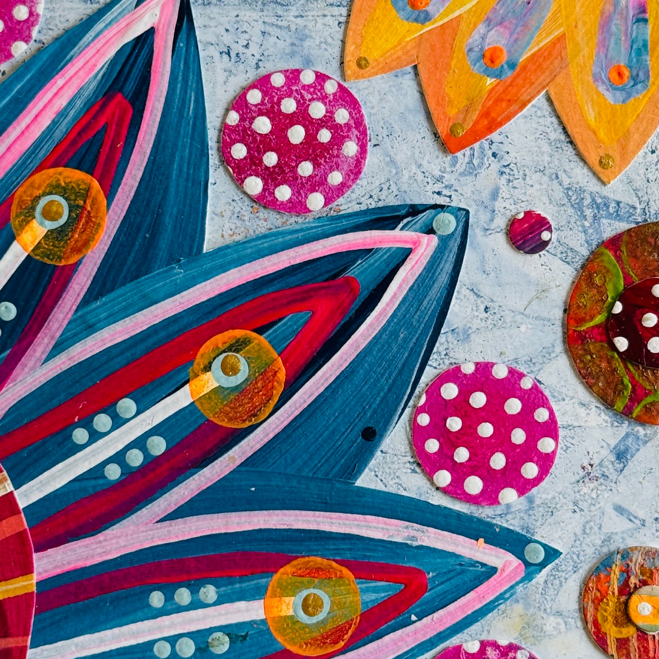 Small square wood panel art with a bold patterned floral design and hand-painted collage elements.