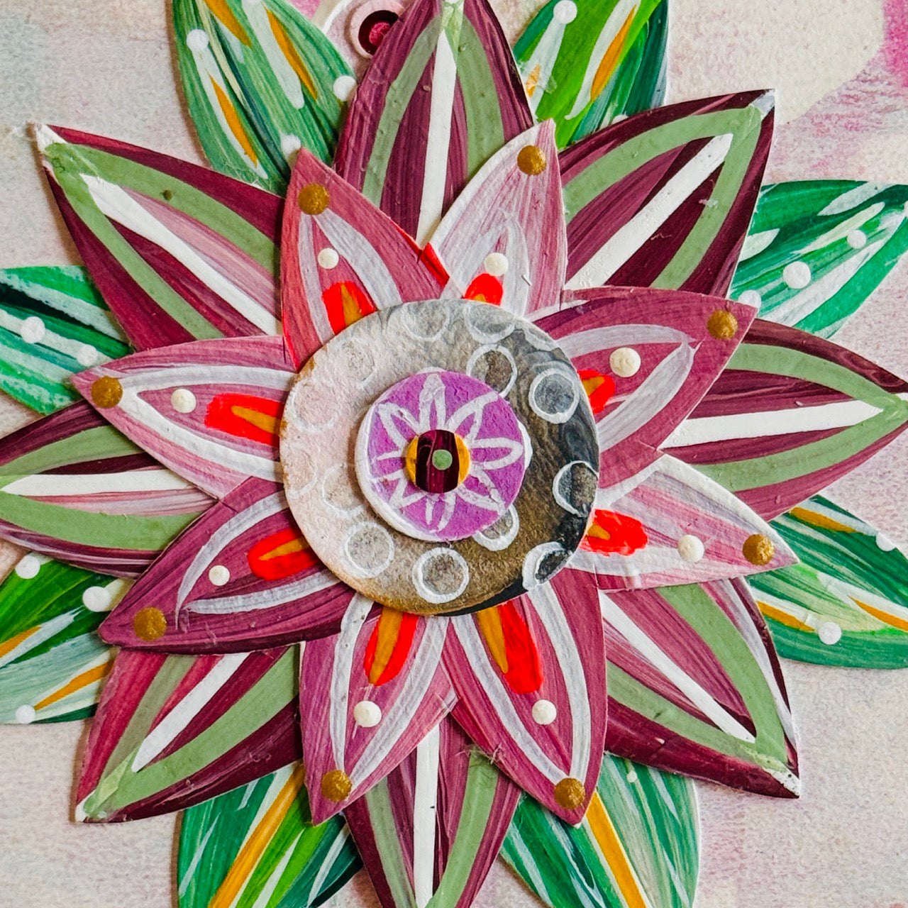 Small square wood panel art with a bold patterned floral design and hand-painted collage elements.