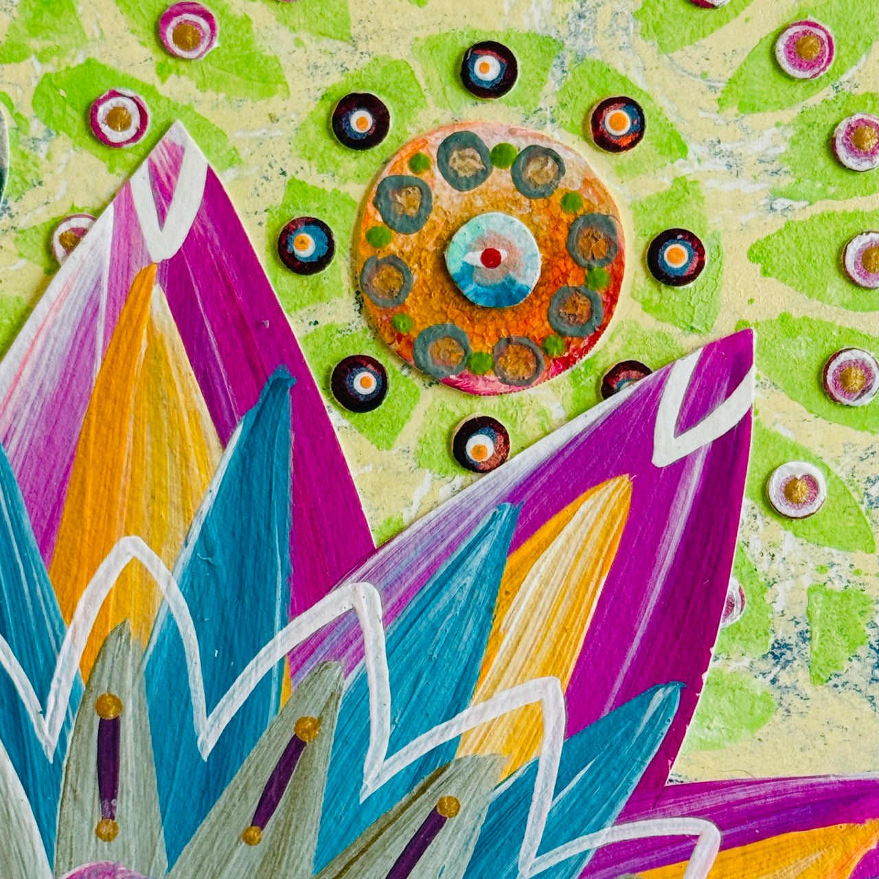 Small square wood panel art with a bold patterned floral design and hand-painted collage elements.