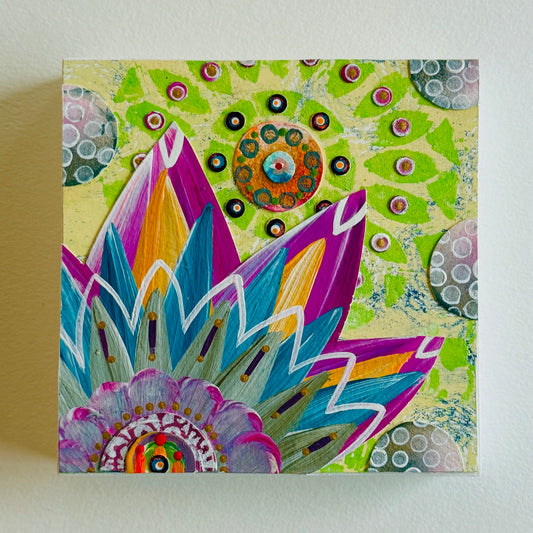 Small square wood panel art with a bold patterned floral design and hand-painted collage elements.
