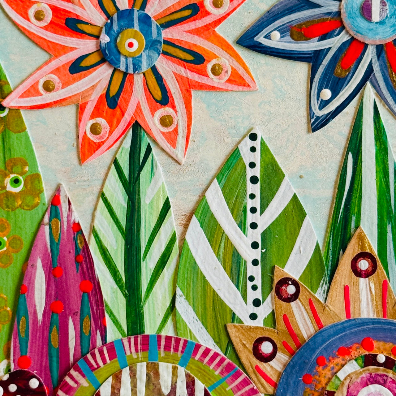 Small square wood panel art with a bold patterned floral design and hand-painted collage elements.