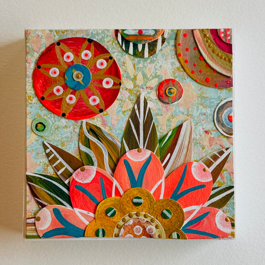 Small square wood panel art with a bold patterned floral design and hand-painted collage elements.