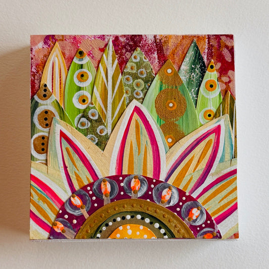 Small square wood panel art with a bold patterned floral design and hand-painted collage elements.