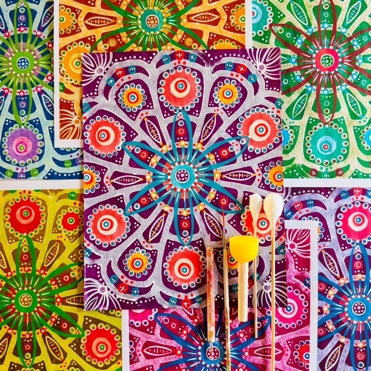 A vibrant collection of hand-painted Mexico-inspired patterned papers featuring bold floral motifs and layered geometric designs in rich pinks.