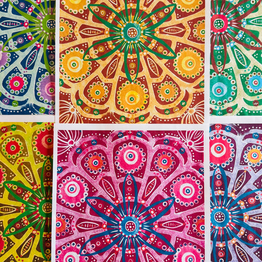 A vibrant collection of hand-painted Mexico-inspired patterned papers featuring bold floral motifs and layered geometric designs in rich pinks, purples, golds, and greens.