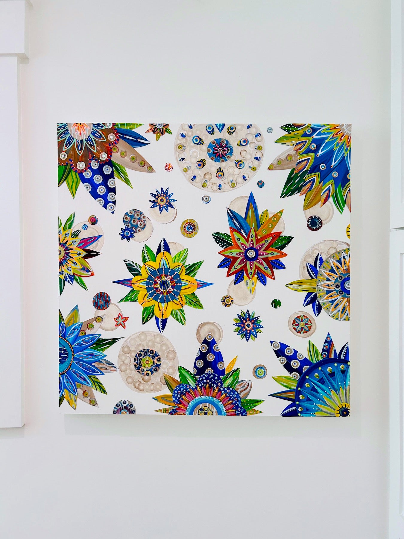 30 X 30 X 1.5 inch wall art is made on professional-grade MDF panel. It has vibrant botanicals painted in deep blues, terra cotta, and a relaxing beige. Bright pops of yellow and orange, along with subtle hints of varying grays