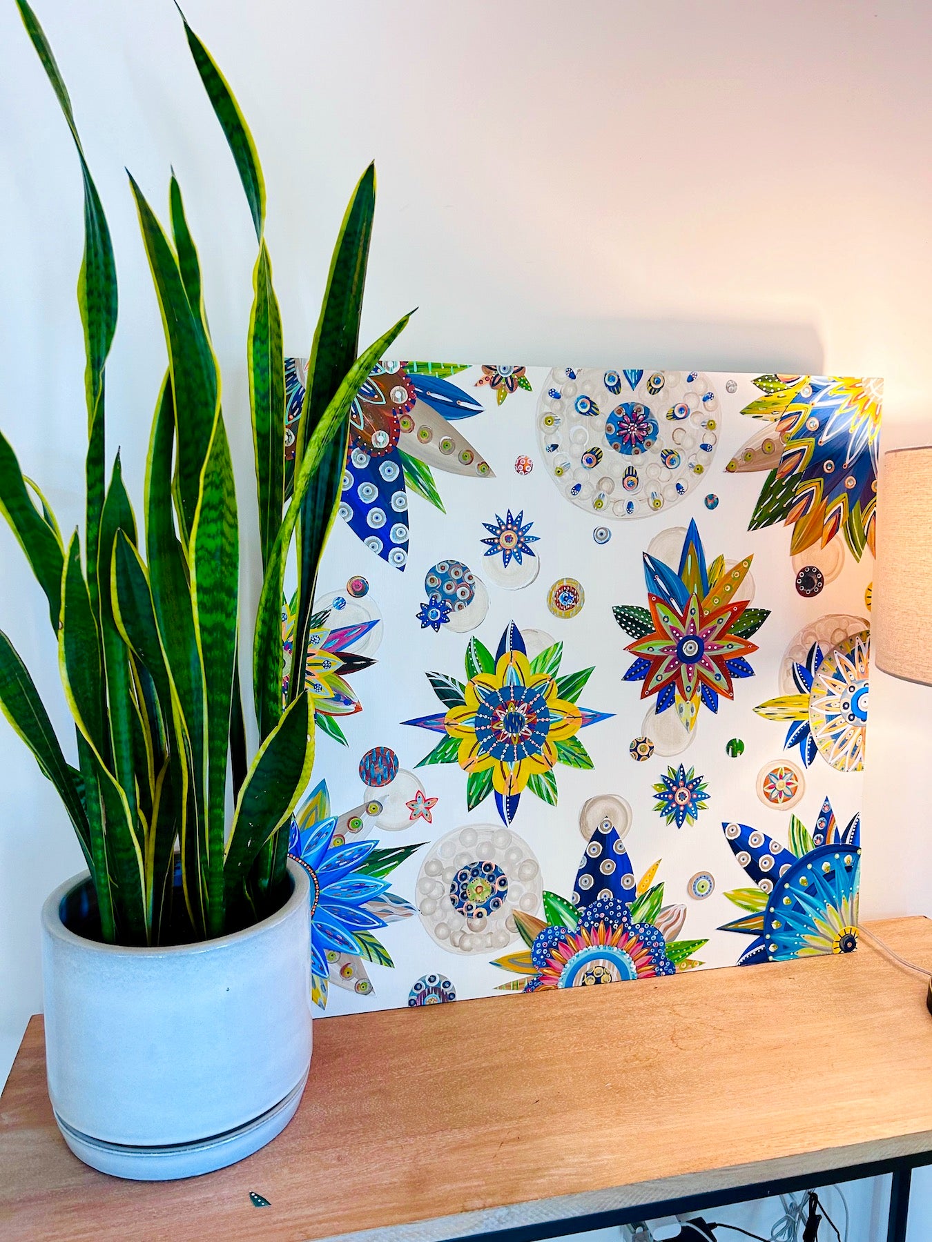 30 X 30 X 1.5 inch wall art is made on professional-grade MDF panel. It has vibrant botanicals painted in deep blues, terra cotta, and a relaxing beige. Bright pops of yellow and orange, along with subtle hints of varying grays