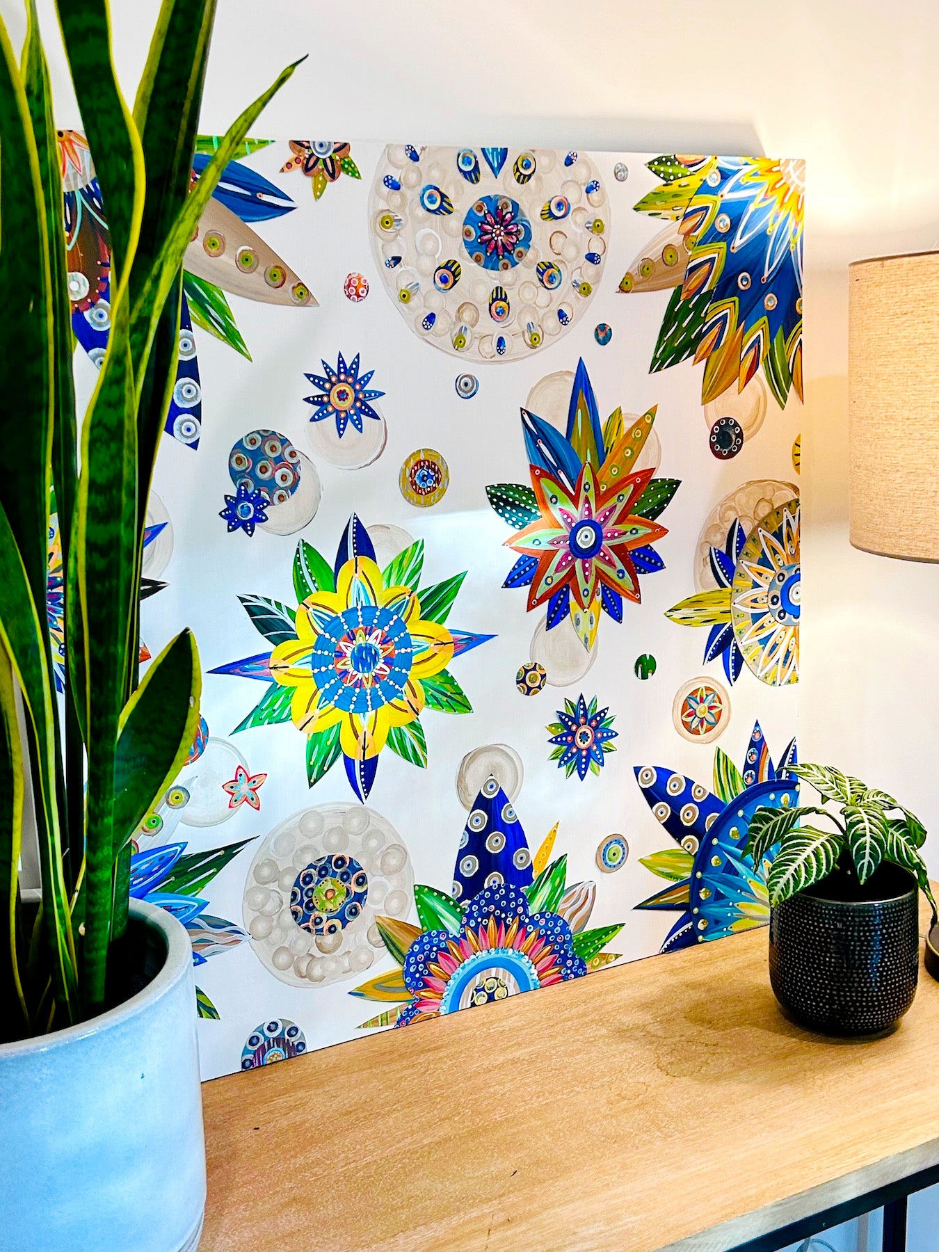 30 X 30 X 1.5 inch wall art is made on professional-grade MDF panel. It has vibrant botanicals painted in deep blues, terra cotta, and a relaxing beige. Bright pops of yellow and orange, along with subtle hints of varying grays